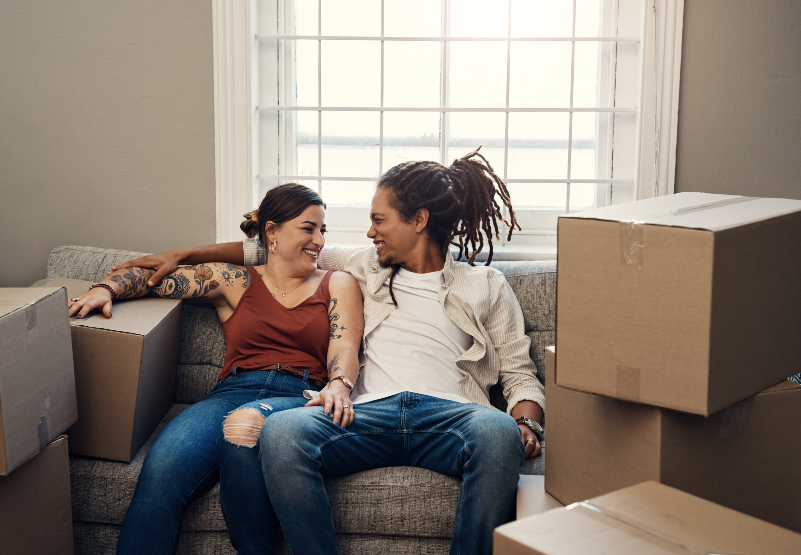 Im sure well make great memories here. Shot of a happy young couple moving into their new home